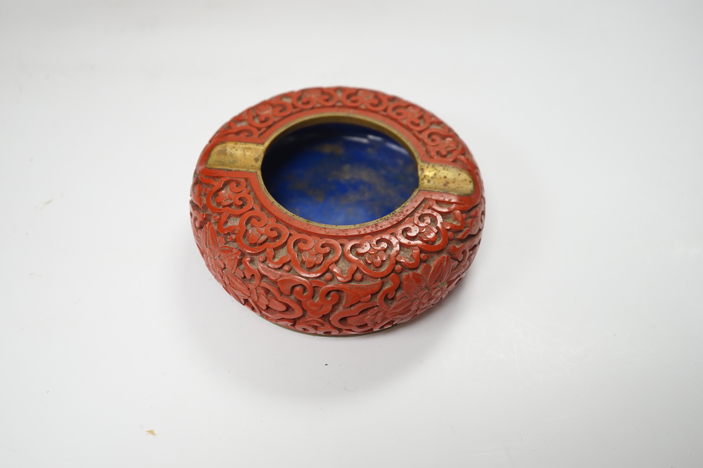 Three Chinese cinnabar lacquer items, a vase, an ashtray and a lidded box, vase 16.5cm